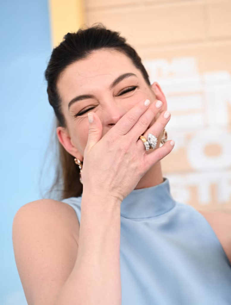 Anne Hathaway’s "coconut water" nails are officially the hero manicure for late summer 2026.